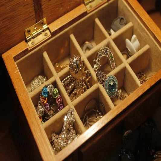 handmade jewelry sitting in a compartmentalized box